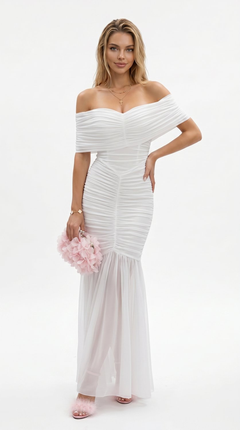 An elegant and feminine evening look featuring a ruched off-shoulder mermaid gown, layered gold jewe